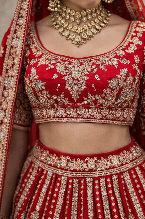 Red Bridal Lehenga Choli with Heavy Gold Embroidery